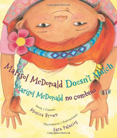 marisol mcdonald book cover showing upsidedown red haired girl
